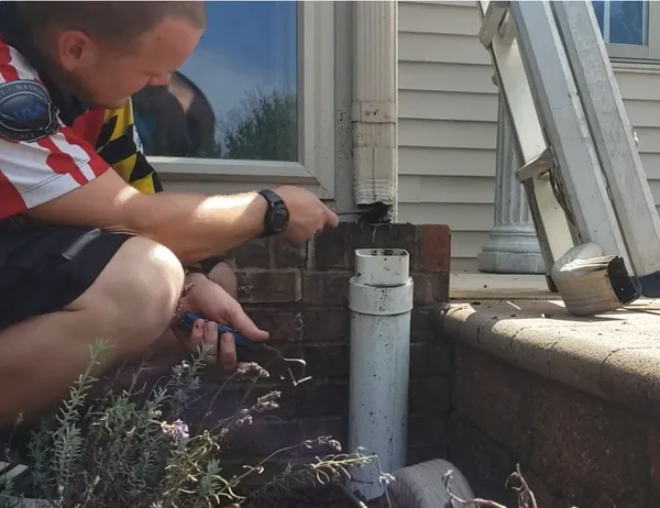Downspout cleaning service — clearing blocked downspouts in Cartersville GA